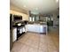 Well-equipped kitchen featuring stainless steel appliances, white cabinetry, and tile floors at 8340 Winterchase Pl, Las Vegas, NV 89143