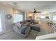 Inviting living room featuring a large sectional, natural light, and an open-concept design at 8340 Winterchase Pl, Las Vegas, NV 89143