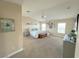 Spacious bedroom featuring neutral colors, carpet flooring, and natural light from two windows at 8340 Winterchase Pl, Las Vegas, NV 89143