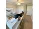 Home office featuring ceiling fan, white desk, accent furniture, and neutral color scheme at 8340 Winterchase Pl, Las Vegas, NV 89143