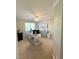 Bright home office with ceiling fan, large window, white desk, and neutral color scheme at 8340 Winterchase Pl, Las Vegas, NV 89143