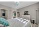 Cozy bedroom featuring comfortable bedding, ample natural light, and a view of the closet at 8501 W University Ave # 1083, Las Vegas, NV 89147