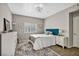 Comfortable bedroom featuring a decorative rug, dresser, and ample natural light at 8501 W University Ave # 1083, Las Vegas, NV 89147