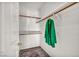 Well-organized walk-in closet with ample shelving, hanging rods, and an area rug at 8501 W University Ave # 1083, Las Vegas, NV 89147