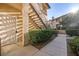 Attractive condo exterior with a walkway, landscaping, and stairwell to upper units at 8501 W University Ave # 1083, Las Vegas, NV 89147
