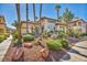 A beautiful apartment building with lush foliage, rock landscaping, and a serene atmosphere at 8501 W University Ave # 1083, Las Vegas, NV 89147