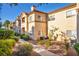 A well-manicured apartment complex featuring a warm-toned exterior and attractive landscaping at 8501 W University Ave # 1083, Las Vegas, NV 89147