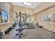Well-equipped fitness center featuring weight machines, cardio equipment, and mirrors at 8501 W University Ave # 1083, Las Vegas, NV 89147