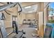 Bright fitness center featuring treadmills, elliptical, weights, and natural light at 8501 W University Ave # 1083, Las Vegas, NV 89147