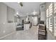 Open floor plan with tile flooring connecting kitchen, dining, and living areas at 8501 W University Ave # 1083, Las Vegas, NV 89147