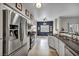 Open concept kitchen featuring stainless steel appliances and an adjoining dining area at 8501 W University Ave # 1083, Las Vegas, NV 89147