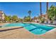 Community pool with lounge chairs and lush landscaping, perfect for relaxation at 8501 W University Ave # 1083, Las Vegas, NV 89147