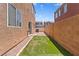 Backyard features artificial turf, gravel and view of neighborhood at 9021 Last Hope Ave, Las Vegas, NV 89178