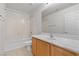 This bathroom has tile floors, a bathtub and a vanity at 9021 Last Hope Ave, Las Vegas, NV 89178