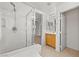 Elegant bathroom with tile flooring, glass-enclosed shower and soaking tub at 9021 Last Hope Ave, Las Vegas, NV 89178