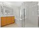 The bright bathroom features dual sinks, a soaking tub, and a separate glass-enclosed shower at 9021 Last Hope Ave, Las Vegas, NV 89178