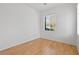 Neutral bedroom with hardwood flooring and a window at 9021 Last Hope Ave, Las Vegas, NV 89178