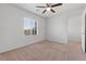 A carpeted bedroom with windows letting in natural light at 9021 Last Hope Ave, Las Vegas, NV 89178