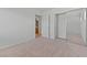 A carpeted bedroom with a sliding closet door and a door to the bathroom at 9021 Last Hope Ave, Las Vegas, NV 89178