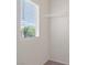 Bright walk-in closet with window for natural light and shelving at 9021 Last Hope Ave, Las Vegas, NV 89178
