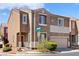 Two-story home featuring an attached two-car garage and well-maintained landscaping at 9021 Last Hope Ave, Las Vegas, NV 89178