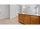 Kitchen featuring an island with wood cabinets and access to the garage at 9021 Last Hope Ave, Las Vegas, NV 89178
