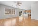 Open-concept living room featuring wood laminate floors and abundant natural light at 9021 Last Hope Ave, Las Vegas, NV 89178