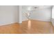 Open living space with wood laminate flooring, staircase, and neutral walls at 9021 Last Hope Ave, Las Vegas, NV 89178