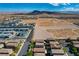Residential aerial featuring modern homes amidst desert landscape, highlighting community development and open space at 9327 S Chieftain St, Las Vegas, NV 89178