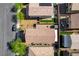 Aerial view of terracotta-roofed home with a well-maintained yard, set in a friendly neighborhood at 9327 S Chieftain St, Las Vegas, NV 89178