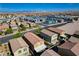 Overhead view of a neighborhood showing well-maintained homes and landscaping under a bright, clear sky at 9327 S Chieftain St, Las Vegas, NV 89178