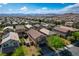 Beautiful aerial view of a well-maintained community with mountain views on a clear, sunny day at 9327 S Chieftain St, Las Vegas, NV 89178