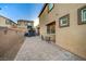 Paver patio in backyard, providing ample room for outdoor seating and activities, alongside a fenced yard at 9327 S Chieftain St, Las Vegas, NV 89178