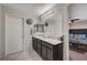 Bathroom featuring a double sink vanity with granite countertop, and a neutral color scheme at 9327 S Chieftain St, Las Vegas, NV 89178