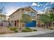 Charming two-story home with a well-manicured yard and a two-car garage, enhancing its curb appeal at 9327 S Chieftain St, Las Vegas, NV 89178