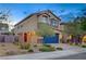 Inviting exterior showing a two-story home with a blue garage door, landscaping, and stylish accents at 9327 S Chieftain St, Las Vegas, NV 89178