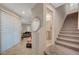 Hallway with staircase and view of a bathroom and living area at 9327 S Chieftain St, Las Vegas, NV 89178