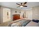 Large main bedroom with a ceiling fan, dresser, and a comfy dog bed at 9327 S Chieftain St, Las Vegas, NV 89178