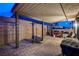 Spacious brick-paved patio with a covered area, ideal for outdoor gatherings, featuring grilling and lounge space at 9327 S Chieftain St, Las Vegas, NV 89178