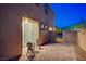 Cozy outdoor patio with brick pavers, perfect for relaxing and entertaining with a sliding door entrance at 9327 S Chieftain St, Las Vegas, NV 89178