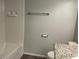 Bright bathroom features a tub, tile surround, and modern fixtures at 9333 Leaping Deer Pl # 103, Las Vegas, NV 89178