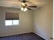 Cozy bedroom with carpet flooring and a ceiling fan at 9333 Leaping Deer Pl # 103, Las Vegas, NV 89178