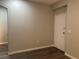 Minimalist bedroom with hardwood flooring and neutral-colored walls at 9333 Leaping Deer Pl # 103, Las Vegas, NV 89178