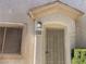 Close-up of the front door entrance with a security screen and the house number clearly displayed at 9333 Leaping Deer Pl # 103, Las Vegas, NV 89178
