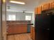 Functional kitchen featuring wooden cabinets, modern appliances, and an open design that connects to the living area at 9333 Leaping Deer Pl # 103, Las Vegas, NV 89178