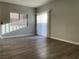 Open living room features wood-style flooring and natural light at 9333 Leaping Deer Pl # 103, Las Vegas, NV 89178