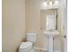 Clean half bath featuring toilet and pedestal sink at 9552 Wooden Pier Way, Las Vegas, NV 89117