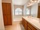 Well-lit bathroom offers a soaking tub, vanity, and linen storage at 9552 Wooden Pier Way, Las Vegas, NV 89117