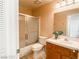 Bright bathroom features a shower-tub, vanity, and a medicine cabinet, providing a functional and updated space at 9552 Wooden Pier Way, Las Vegas, NV 89117