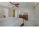 Bedroom with neutral walls and carpet, ceiling fan, closet, and chest of drawers at 9552 Wooden Pier Way, Las Vegas, NV 89117